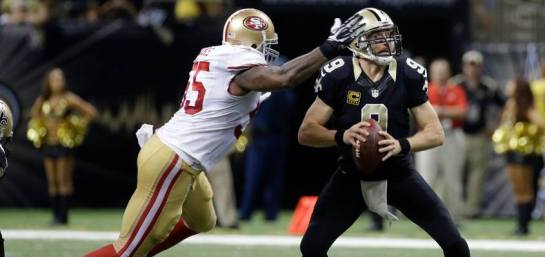 Drew Brees is about to be sacked by Ahmad Brooks of the 49ers.
