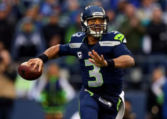Russell Wilson keeps plays alive with his legs if they're not there initially.