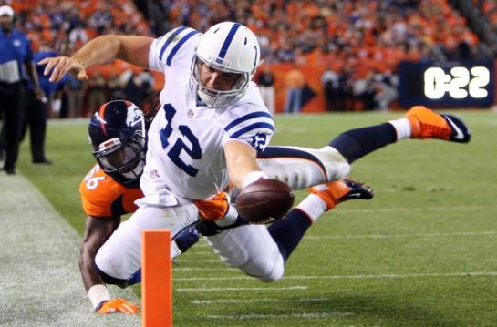 Luck scores in last year's playoff win in Denver.