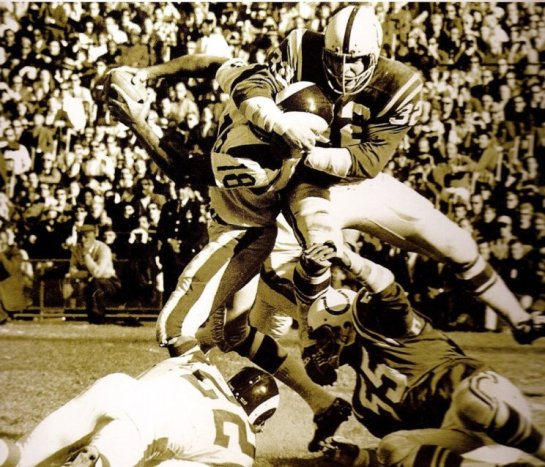 Mike Curtis nearly beheads Roman Gabriel.