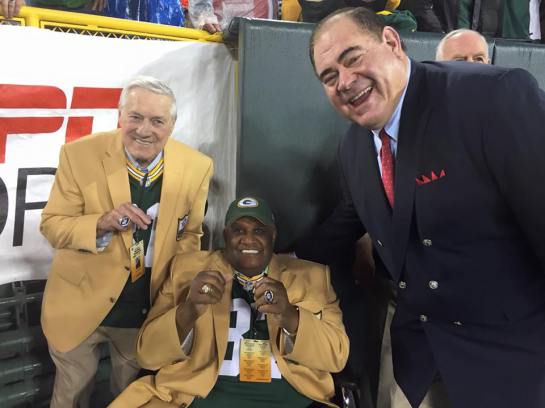 Hall of Fame President David Baker presenting Jim Taylor and Willie Davis new PFHofF rings.